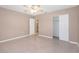 Bright bedroom with ceiling fan and spacious closet at 5931 Pine St, New Port Richey, FL 34652