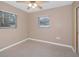 Spacious bedroom with ceiling fan and large windows at 5931 Pine St, New Port Richey, FL 34652