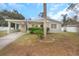 Charming single story home with carport and well-manicured lawn at 5931 Pine St, New Port Richey, FL 34652