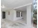Covered front porch with access to carport and front door at 5931 Pine St, New Port Richey, FL 34652
