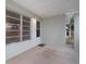 Covered front porch with access to front door and window at 5931 Pine St, New Port Richey, FL 34652
