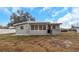Front view of a ranch-style house with a yard at 5931 Pine St, New Port Richey, FL 34652