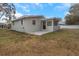 Ranch-style home with a backyard and patio at 5931 Pine St, New Port Richey, FL 34652