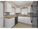 Modern kitchen with white cabinets and granite countertops at 5931 Pine St, New Port Richey, FL 34652