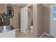 Laundry area with sink, toilet and exterior access at 5931 Pine St, New Port Richey, FL 34652