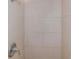 Clean shower with off-white tile and modern fixtures at 5931 Pine St, New Port Richey, FL 34652