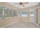 Bright sunroom with multiple windows and access to backyard at 5931 Pine St, New Port Richey, FL 34652