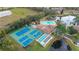 Tennis courts and pool area in a community setting at 6604 Spring Flower Dr # 23, New Port Richey, FL 34653