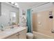 Clean bathroom with a bathtub, shower, and updated vanity at 6604 Spring Flower Dr # 23, New Port Richey, FL 34653