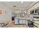 Kitchen with stainless steel appliances and breakfast nook at 6604 Spring Flower Dr # 23, New Port Richey, FL 34653