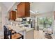 Kitchen with stainless steel appliances and breakfast bar at 6604 Spring Flower Dr # 23, New Port Richey, FL 34653