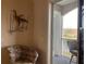 Private balcony with wicker chairs and lake view at 6734 Dali Ave # 206, Land O Lakes, FL 34637