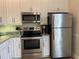 Stainless steel appliances including microwave, oven, and refrigerator at 6734 Dali Ave # 206, Land O Lakes, FL 34637