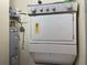 Stackable washer and dryer in a compact laundry room at 6734 Dali Ave # 206, Land O Lakes, FL 34637