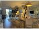 Open concept living and dining area with hardwood floors and access to balcony at 6734 Dali Ave # 206, Land O Lakes, FL 34637