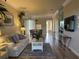 Bright and spacious living room with hardwood floors and comfy furniture at 6734 Dali Ave # 206, Land O Lakes, FL 34637