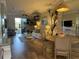 Open concept living room and dining area with hardwood floors and neutral decor at 6734 Dali Ave # 206, Land O Lakes, FL 34637