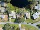 Bird's eye view of house and lakefront lot at 6920 Medlar Dr, New Port Richey, FL 34653