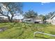 Large backyard with mature tree and shed at 6920 Medlar Dr, New Port Richey, FL 34653