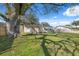 Backyard features a large tree and a shed at 6920 Medlar Dr, New Port Richey, FL 34653