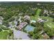 Aerial view of community tennis courts, pool, and clubhouse at 8016 Willow Brook Dr, Spring Hill, FL 34606