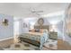 Main bedroom with king-size bed and light blue walls at 8016 Willow Brook Dr, Spring Hill, FL 34606