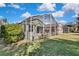 Spacious backyard with a large screened patio at 8148 Ambersweet Pl, Land O Lakes, FL 34637