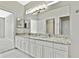 Double vanity bathroom with granite countertop at 8148 Ambersweet Pl, Land O Lakes, FL 34637