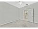 Bedroom with ceiling fan and adjacent bathroom at 8148 Ambersweet Pl, Land O Lakes, FL 34637