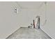 Unfinished garage with water heater and extra space at 8148 Ambersweet Pl, Land O Lakes, FL 34637