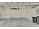 Clean and empty garage, ready for your vehicles and storage at 8148 Ambersweet Pl, Land O Lakes, FL 34637