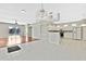 Open concept kitchen and dining area with hardwood floors and modern appliances at 8148 Ambersweet Pl, Land O Lakes, FL 34637