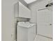 Laundry room with washer, dryer, and cabinets at 8148 Ambersweet Pl, Land O Lakes, FL 34637