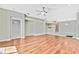 Hardwood floor living room, open to kitchen and other rooms at 8148 Ambersweet Pl, Land O Lakes, FL 34637