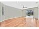 Bright living room with hardwood floors and sliding glass doors at 8148 Ambersweet Pl, Land O Lakes, FL 34637