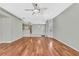 Spacious living room with hardwood floors and access to kitchen at 8148 Ambersweet Pl, Land O Lakes, FL 34637