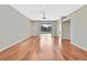 Bright living room featuring hardwood floors and sliding glass doors to backyard at 8148 Ambersweet Pl, Land O Lakes, FL 34637