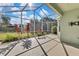 Enjoy the outdoors in this screened patio with lush landscaping at 8148 Ambersweet Pl, Land O Lakes, FL 34637