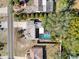 Aerial view showing a house with a pool in a residential neighborhood at 8177 Philatelic Dr, Spring Hill, FL 34606