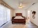 Bedroom with pool view and sliding glass doors to backyard at 8177 Philatelic Dr, Spring Hill, FL 34606