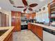 Well-equipped kitchen with wood cabinets, granite counters, and stainless steel appliances at 8177 Philatelic Dr, Spring Hill, FL 34606