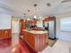 Kitchen boasts island, granite countertops, and stainless steel appliances at 8177 Philatelic Dr, Spring Hill, FL 34606