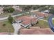 Aerial image showcasing a cluster of villas, ample parking, and surrounding landscape at 8350 High Point Cir # 3, Port Richey, FL 34668