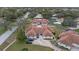 Aerial view of a community of villas with brown roofs and green exteriors at 8350 High Point Cir # 3, Port Richey, FL 34668