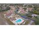 Aerial view of a community with a pool and numerous villas at 8350 High Point Cir # 3, Port Richey, FL 34668
