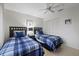 Bedroom with twin beds, ceiling fan and closet at 8350 High Point Cir # 3, Port Richey, FL 34668