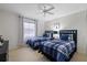 Bedroom with twin beds, ceiling fan, and window at 8350 High Point Cir # 3, Port Richey, FL 34668