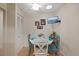 Small breakfast nook with a round table and teal chairs at 8350 High Point Cir # 3, Port Richey, FL 34668