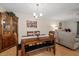 Charming dining room with wood table and bench seating at 8350 High Point Cir # 3, Port Richey, FL 34668