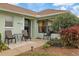 House exterior with patio furniture and landscaping at 8350 High Point Cir # 3, Port Richey, FL 34668